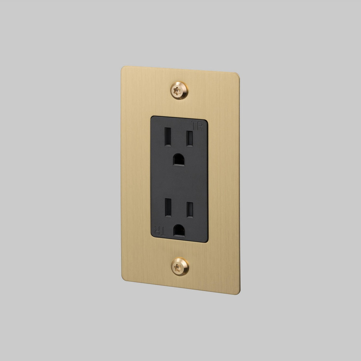 Outlet in Brass