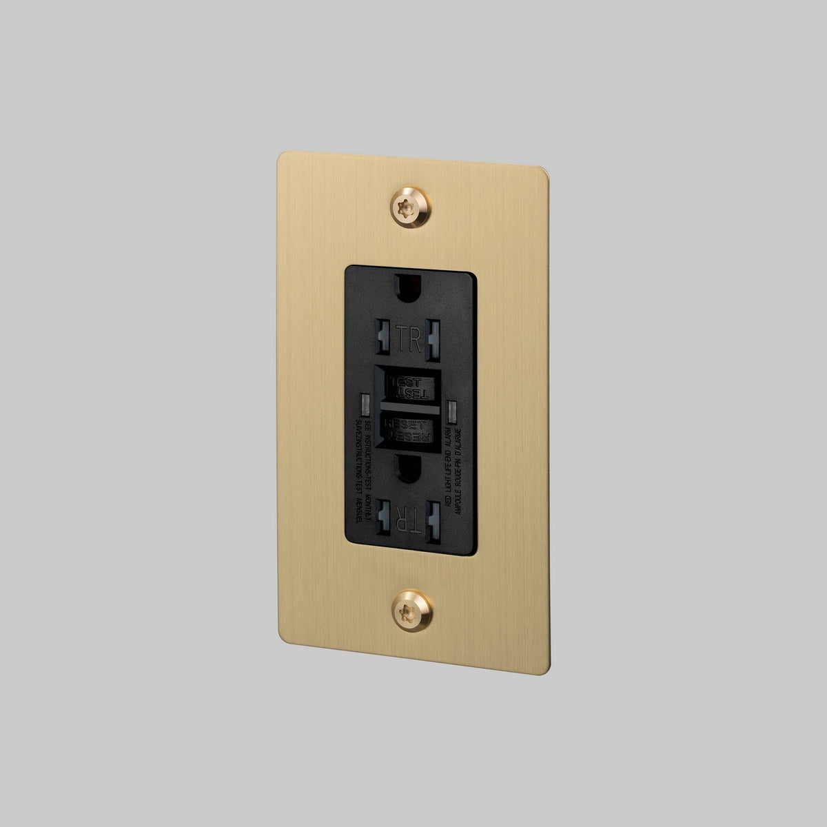Outlet in Brass