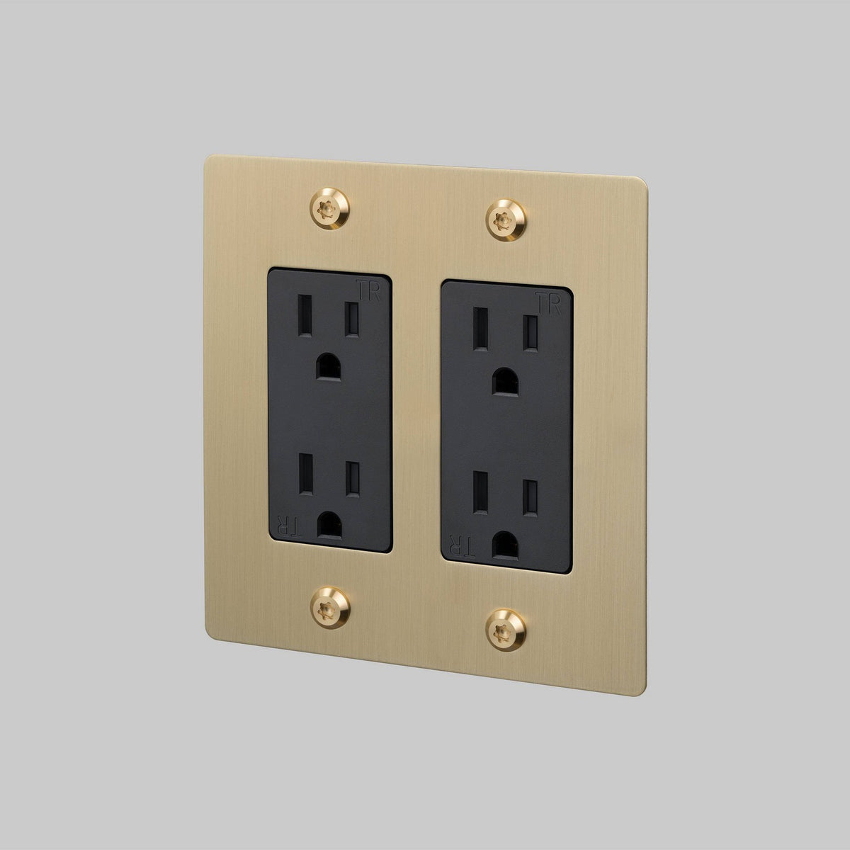 Outlet in Brass